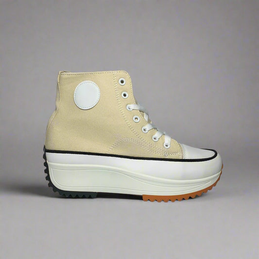 High-Top sneaker with a Beige colour canvas upper, The shoe Features a chunky white sole with a brown rubber sole.