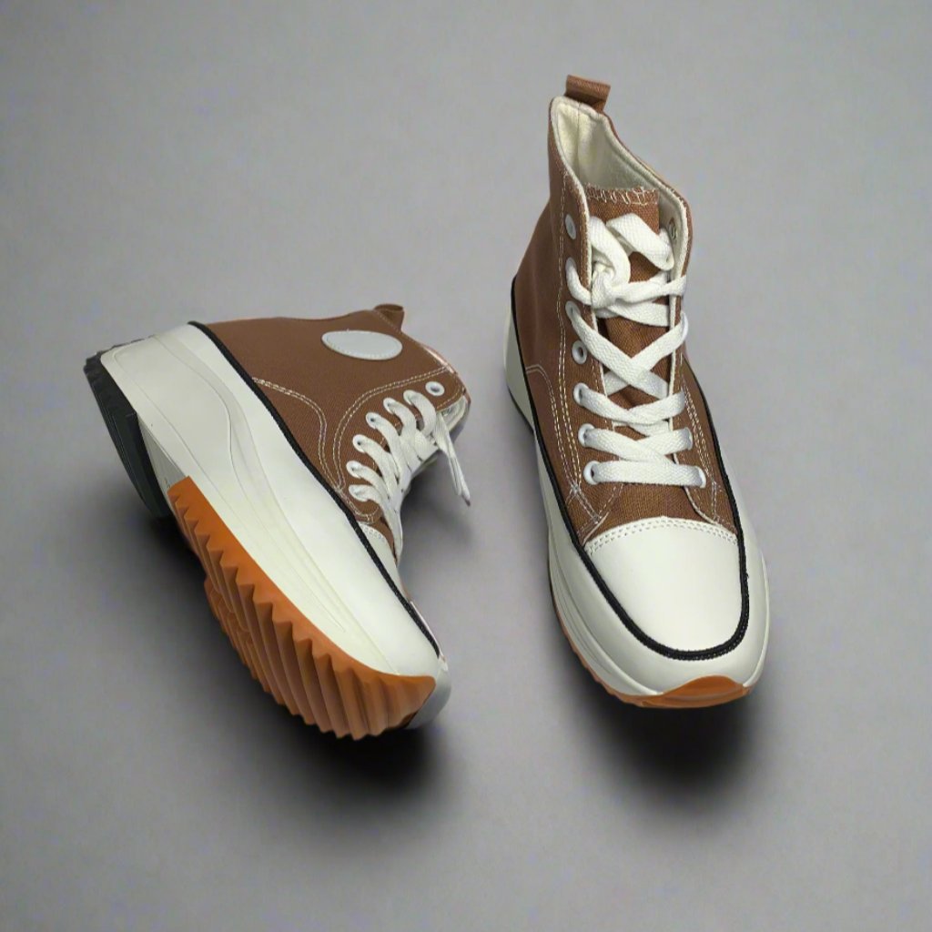 High-Top sneaker with a Brown canvas upper, The shoe Features a chunky white sole with a brown rubber sole.